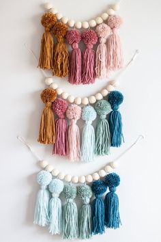 several tassels and beads are hanging on the wall