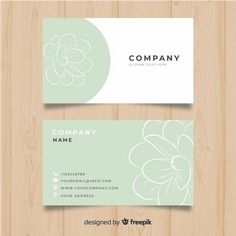 two business cards with flowers on them, one is green and the other is white