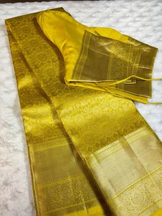 Indulge in luxurious elegance with this Golden yellow kanchipuram silk saree. This saree features a stunning geometric design in a rich golden yellow color, crafted from premium kanchipuram silk. Elevate your wardrobe with this exquisite piece, perfect for any special occasion. This saree is ready to wear with fall and pico done. Comes with stitched blouse - size: 38-46.  SILK MARK CERTIFIED Mustard Kanjeevaram Saree, Semi-stitched Gold Banarasi Silk Traditional Wear, Wedding Tussar Silk Kurta With Cutdana, Wedding Kurta With Cutdana On Tussar Silk, Elegant Yellow Saree For Transitional Season, Elegant Tissue Silk Salwar Kameez With Zari Weaving, Elegant Salwar Kameez With Zari Weaving In Tissue Silk, Transitional Season Gold Lehenga With Pallu, Festive Gold Tussar Silk Kurta