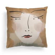 a pillow with an image of a woman's face on it