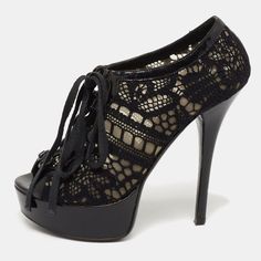 The Intricate Lace Detailing Of These Dolce And Gabbana Booties Offers Them A Truly Ever Lasting Appeal. Created From Patent Leather, They Are Styled With Lace Up Vamps, Peep Toes, And Black Tone Hardware. The 13.5cm Heels And Platforms Of This Pair Will Fill Your Day With Bold And Confident Steps. Elegant Lace Evening Heels, Black Lace Party Heels, Elegant Lace Heels With Laces, Black Lace Heels For Party, Elegant Lace-up Heels In Lace Material, Elegant Black Heels With Laces, Elegant High Heel Laced Heels, Black Heels For Evening, Lace Heels With Laces For Party