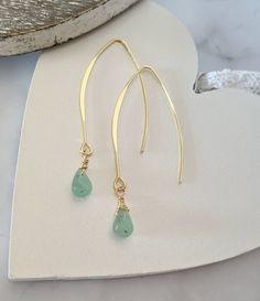 Green aventurine gemstone earrings on 18k gold plated hooks. Beautiful gold wire wrapped aventurine beads which look quite emerald in colour, perfect for spring. These earrings measure 4cm in length approx and are supplied with rubber safety backs. Posted in protective pockets and organza bags so they would also make ideal gifts. If you have any questions or would like any more information please just ask 🙂 Gold Emerald Earrings, Orange Crystals, Bar Bracelets, Gold Bracelet Chain, Emerald Earrings, Gold Wire, Green Aventurine, Heart Pendant Necklace, Boho Necklace