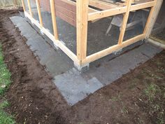 a chicken coop is built into the ground