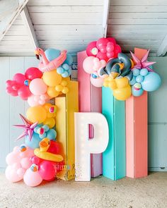 the letters p and p are decorated with balloons, stars, and other things in pastel colors