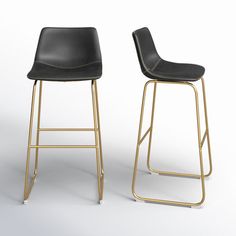 two black and gold barstools with one standing up against the other, on a white background