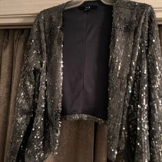 Beautiful Nwt Blue Grey Sequin Jacket. Size Large. No Stretch Really. Front Has No Closure. 100% Polyester. Purchased From Forever Xxi. Fitted Long Sleeve Blazer From Forever 21, Forever 21 Outerwear For Winter Night Out, Forever 21 Winter Outerwear For Night Out, Chic Forever 21 Outerwear For Night Out, Chic Outerwear For Night Out By Forever 21, Side Dips, Sequin Coats, Sequin Jacket, Forever 21 Jacket