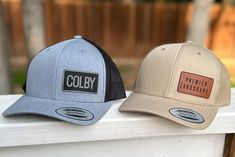 These popular personalized trucker hats have the precurved bill and have a snapback. We can add your custom patch with your name. Price is per hat. If you need two hats, please add two items to your cart.   Perfect for businesses, events, vacation or everyday use.   Our Leatherette patches offer the look and feel of genuine leather without using animal products. These richly textured, water resistant patches ensure you will get the quality you expect and are rugged enough to stand up to any adve Customizable Brown Trucker Hat For Outdoor, Customizable Brown Trucker Hat, Casual 5-panel Trucker Hat With Custom Logo, Trucker Hat With Leather Patch, Six-panel, Outdoor Six-panel Trucker Hat With Leather Patch, Grey Hat, Custom Trucker Hats, Personalized Hats, Personalized Logo