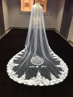 a wedding veil on display in front of a window