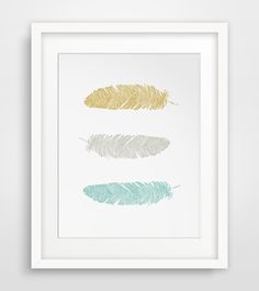 three feathers in different colors on a white background, one is gold and the other is blue