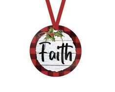 a christmas ornament hanging from a red ribbon with the word faith on it