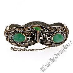 "This very well made vintage bracelet was crafted in gilt sterling silver and features a nice large size consisting of 5 wide links with domed surface adorned with absolutely amazing filigree designs and detailed work that truly make a special statement on this bracelet. Each of the links is bezel set at its center with an oval cut jade gemstone which shows gorgeous marbled green color. Remarkably unique bracelet in excellent condition and guaranteed to please. Enjoy! Material: Solid .925 Sterli Ornate Oval Engraved Bracelets, Ornate Hallmarked Oval Bracelets, Ornate Oval Hallmarked Bracelets, Antique Oval Hallmarked Bracelet, Antique Oval Engraved Bracelets, Vintage Oval Engraved Bracelets, Vintage Engraved Oval Bracelets, Montclair Nj, Jade Gemstone