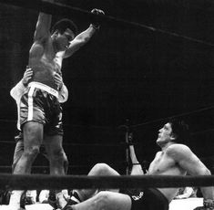 an old photo of two men in the ring