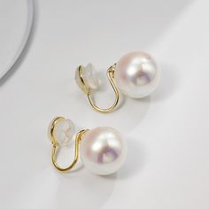 Pearl stud earrings for both pierced and non-pierced ears Coming with 12-16mm pearls, this pearl earrings stud is made of large faux pearls which have a thick luster even than normal real pearls. The pearl stud earrings are available in two types of backs: pin backs and clip-on backs. The pin backs of large pearl stud earrings are made of sterling silver which well protects pierced ears from irritations and allergies. For those who have non pierced ears, the clip on pearl earrings will properly Large Pearl Earrings, Real Pearls, Earrings Stud, Large Earrings, Pearl Stud Earrings, Pin Backs, Pearl Studs, Pierced Ears, Ear Piercings