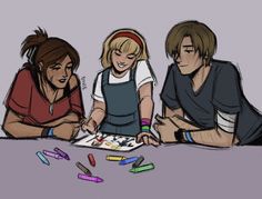 three people sitting at a table with crayons in front of them