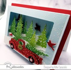 a christmas card with a red truck and trees