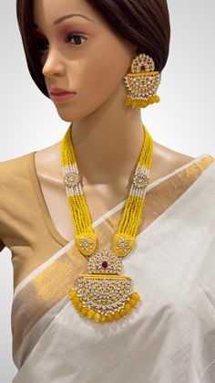 Yellow Kundan long necklace set/Kundan rani haar/Kundan Mala Set/Multi strand necklace/Indian jewelry/Kundan jewelry/Bridal necklace/wedding This is 100% Handmade jewelry. So Color, shades, texture displayed may slightly vary from the actual product due to digital image limitations. We request you to consider these minor variations. Please expect the possibility of some slight imperfections when buying handmade jewelry. If you have any questions, please message or email us. Arrives in a gift box Luxury Gold Kundan Necklace With Dual-tone, Luxury Yellow Gold Temple Jewelry Kundan Necklace, Luxury Yellow Gold Kundan Pendant Necklace, Luxury Yellow Gold Kundan Necklace For Celebration, Luxury Gold Long Kundan Necklace, Luxury Kundan Jewelry In Yellow Gold, Luxury Hand-set Yellow Gold Kundan Necklace, Kundan Mala, Kundan Long Necklace