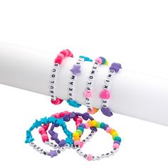 This assortment of colorful beaded bracelets features cute messages on each bracelet in letter beads. "Be kind", "Dream big" and "Fabulous" are a few of the messages featured within this assortment of beaded bracelets. Great as party favors for a young girl's birthday party or as classroom prizes and rewards, these bracelets will be a hit with kids! Plastic. (2 dozen per unit) 1/2" beads with 7 1/2" stretchy cord. Assortment may vary. © OTC Cheap Party Bracelets With Letter Beads, Adjustable Letter Beads Bracelets For Party, Multicolor Letter Beads Bracelets For Party, Pink Letter Beads Bracelets For Party Favors, Playful Beaded Bracelets With Letter Beads For Party Favors, Colorful Beaded Bracelets, Letter Bead Bracelet, Sleepover Tents, Letter Bead Bracelets