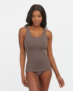 Your go-to essential and everyday layering piece, our SPANXsmooth™ Socialight Tank delivers lightweight compression for all-day wear. A tank top made from super-soft microfiber that's comfortable, breathable and quick-drying, and engineered with no-dig adjustable straps, it's the perfect smoothing shapewear base underneath any of your tops. | Spanx Women's SPANXsmooth Socialight Tank Top Versatile Compressive Tank Top With Medium Bust Support, Compressive Seamless Shapewear Top, Fitted Tank Top With Seamless Construction, Stretch Sleeveless Tops With Soft Touch, Fitted Full Coverage Tank Top With Seamless Construction, Full Coverage Fitted Top With Soft Touch, Fitted Tops With Soft Touch, Fitted Full Coverage Top With Soft Touch, Compressive Seamless Tank Top Shapewear