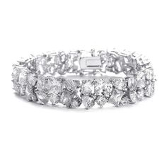 CZ Bridal Bracelet 3012B Our favorite cz bracelet! This bedazzling wedding bracelet features a brilliant arrangement of brilliant cubic zirconia (CZ) crystals in round, pear, princess and emerald cuts. This bracelet provides lots of sparkle and has the safety clasp used on fine jewelry, giving it an even more elegant look. Size: 1/2" wide and 7" long. Color: Silver. Style: 3012B. This is a beautiful bracelet for the bride, mother of the bride, or for pageant wear. Please allow 1 week for deliver Mother Of The Bride Accessories, Cubic Zirconia Bracelet, Cz Bracelet, Bling Wedding, Cubic Zirconia Jewelry, Elegant Bracelet, Bridal Bracelet, Rhinestone Bracelet, Bridal Jewelry Sets