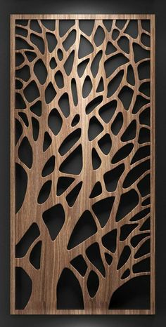 an intricate wooden panel with holes in the center and some leaves cut out on it