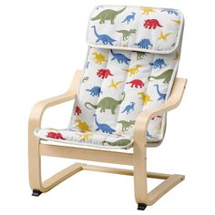 a child's rocking chair with dinosaurs on the back and arms, sitting in front of a white background