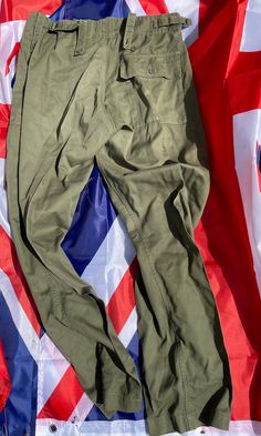 Ex military British army light weight trouser  Side clips to adjust waist  Leg 80 / waist 92/108 In very good condition  See photos Military Style Olive Parachute Pants With Pockets, Green Military Cargo Parachute Pants, Olive Military Cargo Pants, Green Military Cargo Style Parachute Pants, Green Cargo Combat Pants, Military Style Khaki Parachute Trousers, Green Military Cargo Pants For Outdoor, Military Style Green Bottoms With Belt Loops, Green Military Bottoms With Belt Loops