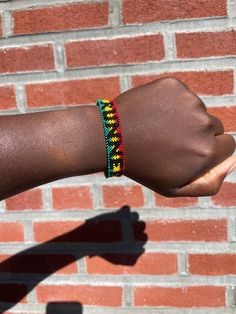 Runner Finisher Bracelet Red Yellow Green Beads with RUNNER in all black beads  One side : Runner Other side : Blank Handmade in Ghana This product was designed by nature to fit the wrist. PLEASE use lotion or soap and water to help get the bracelet over your hand. Black Beaded Friendship Jewelry, Black Beads Jewelry For Friendship, Friendship Bracelets With Black Round Beads, Adjustable Wristband With Black Round Beads, Adjustable Black Beads Wristband, Black Round Beads Friendship Bracelets, Casual Friendship Bracelets With Black Beads As Gift, Black Friendship Bracelets With Round Beads, Friendship Black Beaded Bracelets