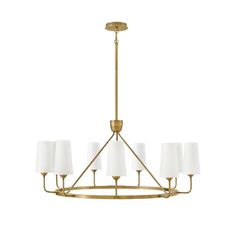 a brass chandelier with white lamps hanging from the bottom and four lights on each side