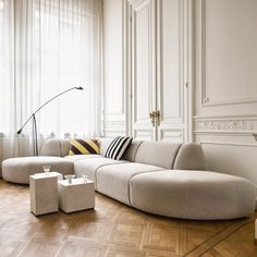 a living room filled with furniture and white walls