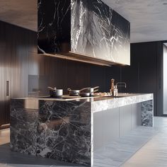 a large kitchen with marble counter tops and black cabinets, along with an island in the middle