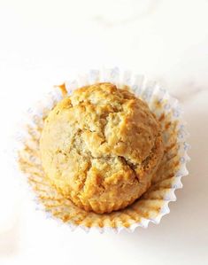 a muffin sitting on top of a white table