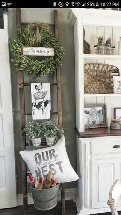 an old ladder is used as a shelf in the kitchen