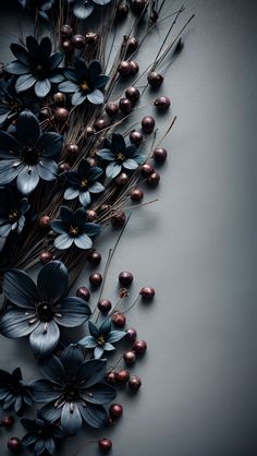 flowers and berries are arranged on a gray surface