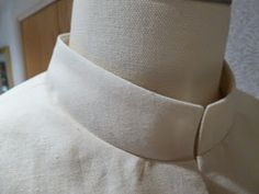 a close up of a dress shirt collar on a mannequin's dummy