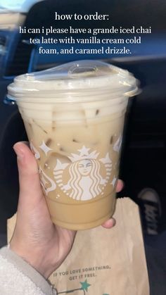 a person holding up a cup of coffee with the caption how to order? if can i please have a grande iced chai tea with vanilla cream cold foam and caramel drize