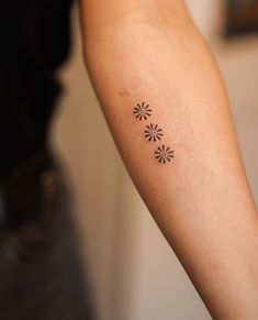 a person with a small tattoo on their arm