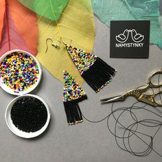 These black and colorful beaded earrings are made of high-quality Czech beads and strong synthetic thread. They are elegant, fashionable, and highly versatile, suitable for everyday wear. Features: Sterling silver components Color: black, colorful mix Length (approximate): 7.5 cm (2.95 in) This item is currently in stock. More beaded earrings http://etsy.me/2ycItdb Gerdan necklaces http://etsy.me/2mihf0J Beaded necklaces http://etsy.me/2Dkf1Fo Crochet necklaces http://etsy.me/2CAPdFc Back to sho Boho Chandelier, Beaded Earrings Native, Native American Earrings, Multicolor Earrings, Handmade Earrings Beaded, Earrings Beaded, Stylish Earring, Beaded Fringe, Seed Bead Earrings