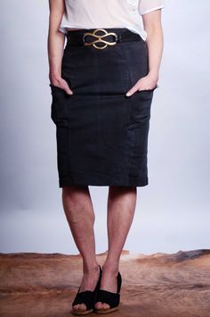 Distressed black denim super stretchy pull on pencil skirt. Princess seam detailing with frayed edge pockets. Double kick pleat at back princess seams for movement and added interest. Style with: Spot On Blazer, Ashley Top, Sensored Top, Katrina Top. Content: Cotton/Lycra Care: Machine wash cold. Tumble dry low. Remove immediately. Made in: Portland, OR Model is 5’6” and is wearing size S, and 5'3" and wearing size XS. Fitted Denim Pencil Skirt With Frayed Hem, Fitted Pencil Skirt With Frayed Hem, Black Stretch Cotton Denim Skirt, Stretch Denim Pencil Skirt With Pockets, Cotton Pencil Skirt With Frayed Hem, Knee-length Cotton Pencil Skirt With Pockets, Cotton Knee-length Pencil Skirt With Pockets, Casual Fitted Washed Black Denim Skirt, Chic Stretch Pencil Skirt With Pockets