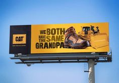 a large billboard with an image of a bulldozer on it's side that says, we both have the same grandpa