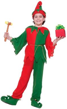 a boy dressed in an elf costume holding a pickle and a red pepper shaker