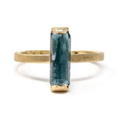 This waterfall of color is simple, classic and bold. You will be intrigued by all that it can do. Stack it with other colorful rings or wear it alone. Deco in feel, but super modern in taste. This 14k recycled gold stacking stone ring features a baguette cut blue tourmaline set in two-sided bezel. Pictured in:14k yellow gold1.26ct blue green tourmaline2mm wide Jennifer Dawes Design works with responsible diamantaires. Due to fluctuations in the diamond market, pricing varies on diamonds based on Modern Stackable Emerald Cut Gemstone Rings, Modern Stackable Emerald Cut 14k Gold Rings, Modern Stackable Rings With Ethical Gemstones In 14k Gold, Modern 14k Gold Emerald Cut Stackable Rings, Modern Yellow Gold Emerald Cut Stackable Rings, Modern 14k Gold Stackable Sapphire Ring, Modern Stackable Rings In Recycled Gold, Modern 14k Gold Sapphire Ring For Everyday, Modern 14k Gold Emerald Ring