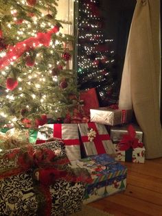 a christmas tree with presents under it