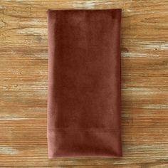 a brown towel on top of a wooden table