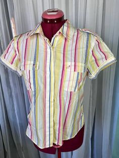 button up shirt striped bright red pink yellow cotton Size medium hidden button front. does have a small stain on back left.  Be aware that vintage sizes may vary from modern standard sizes. See the sizely chart in the product photos for full measurements. The measurements are the most accurate gauge of the garments size. chest, waist and hip measurements are taken laying flat and then doubled. all measurements are approximate.  Vintage items are carefully inspected and I do my best to describe all flaws. but all vintage items may have unnoticed flaws and signs of wear from being preloved. Pink Casual Shirt With Vertical Stripes, Casual Pink Shirt With Vertical Stripes, Pink Vertical Stripes Button-up Top, Pink Vertical Striped Button-up Top, Red Cotton Shirt With Vertical Stripes, Multicolor Short Sleeve Shirt With Vertical Stripes, 80s Shorts, Star Buttons, Empire Waist Dress