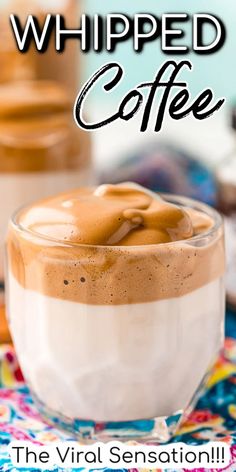 whipped coffee in a glass cup on a colorful table cloth with text overlay that reads, whipped coffee the virtual sensation