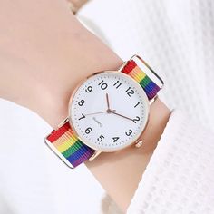 Introducing Our Stylish Rainbow Quartz Wristwatch for Women Step into a world of elegance and style with our Fashion Rainbow Quartz Women's Wristwatch. Crafted with precision and designed to elevate your look, this stunning timepiece is the epitome of sophistication. With a vibrant rainbow-colored fabric belt, this watch adds a pop of color to any outfit, making it perfect for both casual and formal occasions. The quartz movement ensures accurate timekeeping, so you'll never miss a beat. Key Fea Trendy Multicolor Quartz Watches, Wristwatch Fashion, Small Animal Supplies, Rainbow Quartz, Rainbow Design, Fabric Belt, Bracelet Clasps, Elevate Your Look, Women Wrist Watch