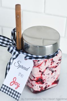 a jar filled with red, white and blue jello sitting on top of a counter