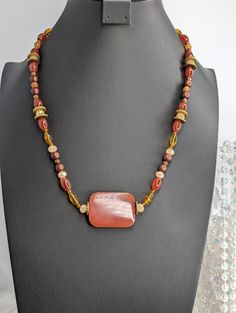 Carnelian is said to promote strength, ignite creativity, promote emotional balance, and physical health. Imagine the feeling of this big carnelian stone sitting on your skin and add to cart today. This is the perfect accent piece for a fall outfit or Thanksgiving dinner.   Make sure to grab this necklace while it lasts since it's a rare find! Measuring in at 25 inches long. Check out the rest of our shop for more unique gemstone beauties! Carnelian Stone, Emotional Balance, Unique Gemstones, Thanksgiving Dinner, Physical Health, Antique Copper, Fall Outfit, Accent Pieces, Your Skin