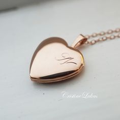 "Own this beautiful heart locket necklace and personalize it with your single Initial in pretty script font. Insert 2 photos for lifetime memories. Perfect gift for birthday, Mother's Day, graduation, Christmas and etc. Metal options: *Sterling Silver *Sterling Silver with Gold overlay *Sterling Silver with rose Gold overlay Locket size shown on photo: 0.8\" locket shape: Heart  Chain: cable -------SHIPPING--------- Allow 10-15 business days for production." Rose Gold Heart Locket, Heart Shape Locket Gold, Rose Gold Locket, Locket Design, Engraved Locket, Gold Heart Locket, Script Initial, Pearl Necklace Designs, Real Gold Jewelry