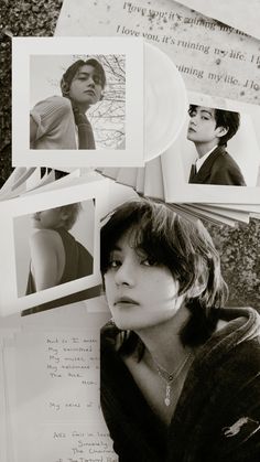 a black and white photo of a woman sitting next to papers with photos on them